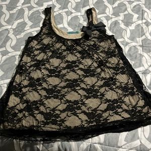 Woman’s sleeveless shirt black lace and tan color not new no tags size large